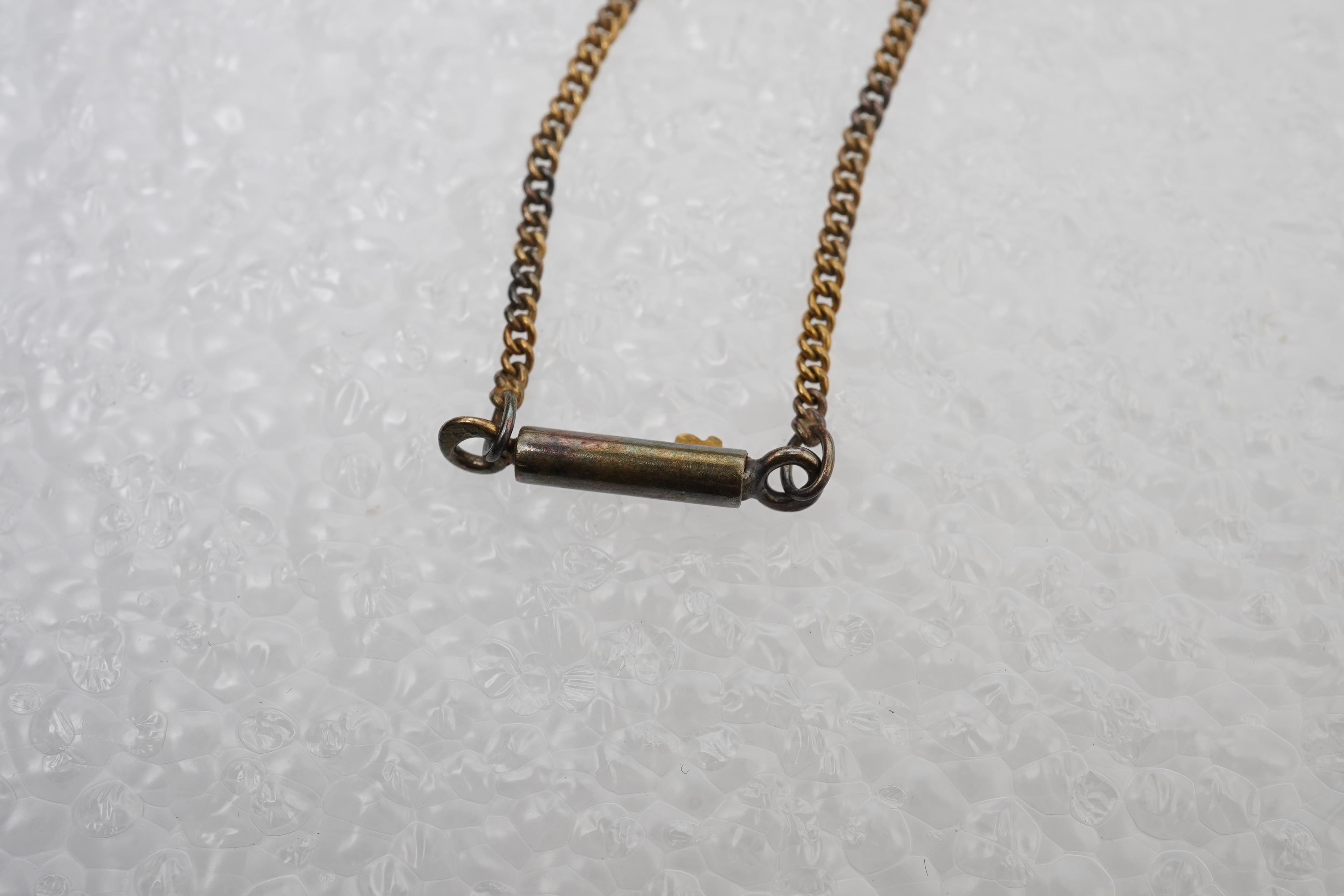 A gold, ruby and seed pearl pendant necklace, early 20th century